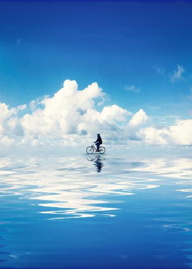 Person Riding A Bike In The Water