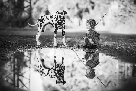 Little boy and dog in the park