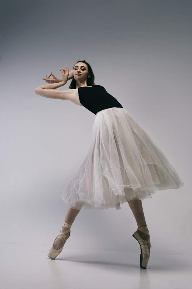 The courage. a young ballerina in a black skirt and Chopin is standing on pointe shoes von Alexandr