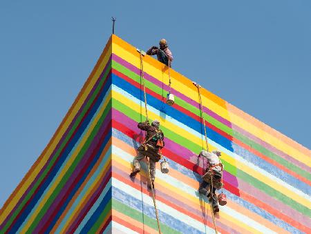 Along the colourful wall pattern