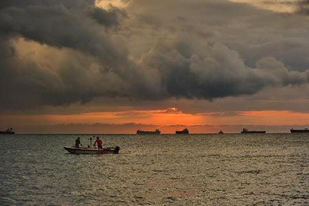 fishermen at sunset