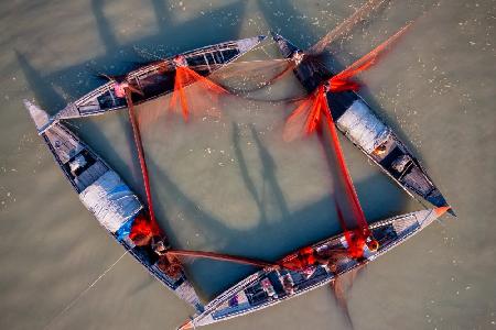 Fishing with boats in the river