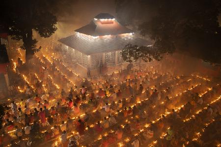 Devotees attend in prayer