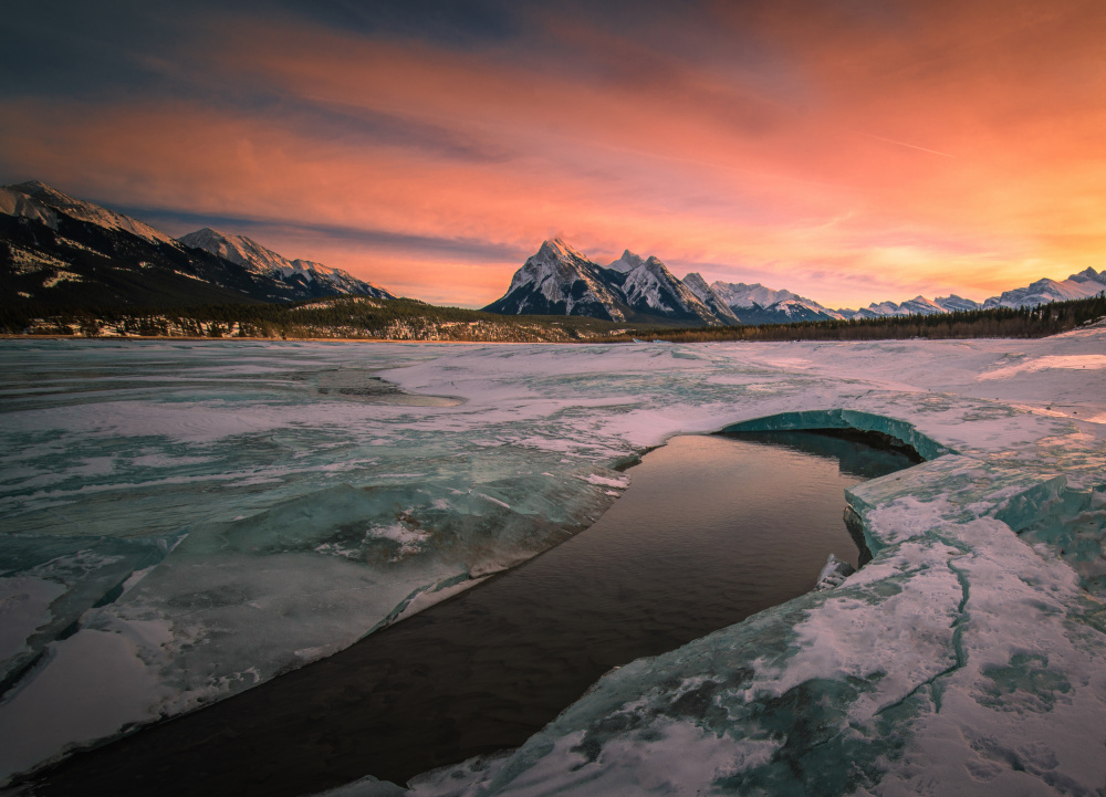 The sunset at a spring thawing lake von Bing Li