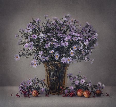 Autumn flowers and pomegranates