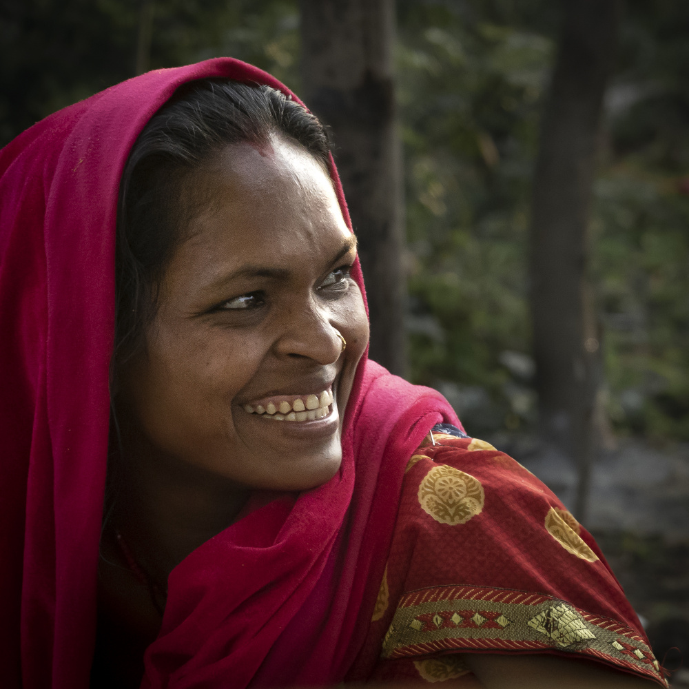 stealing smiles in a village market von Elena Molina