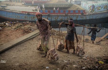 brick transporters at Buriganga river bank