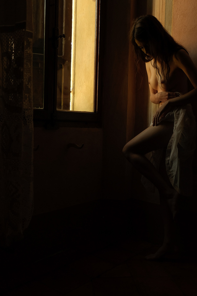 by the window von Federico Cella