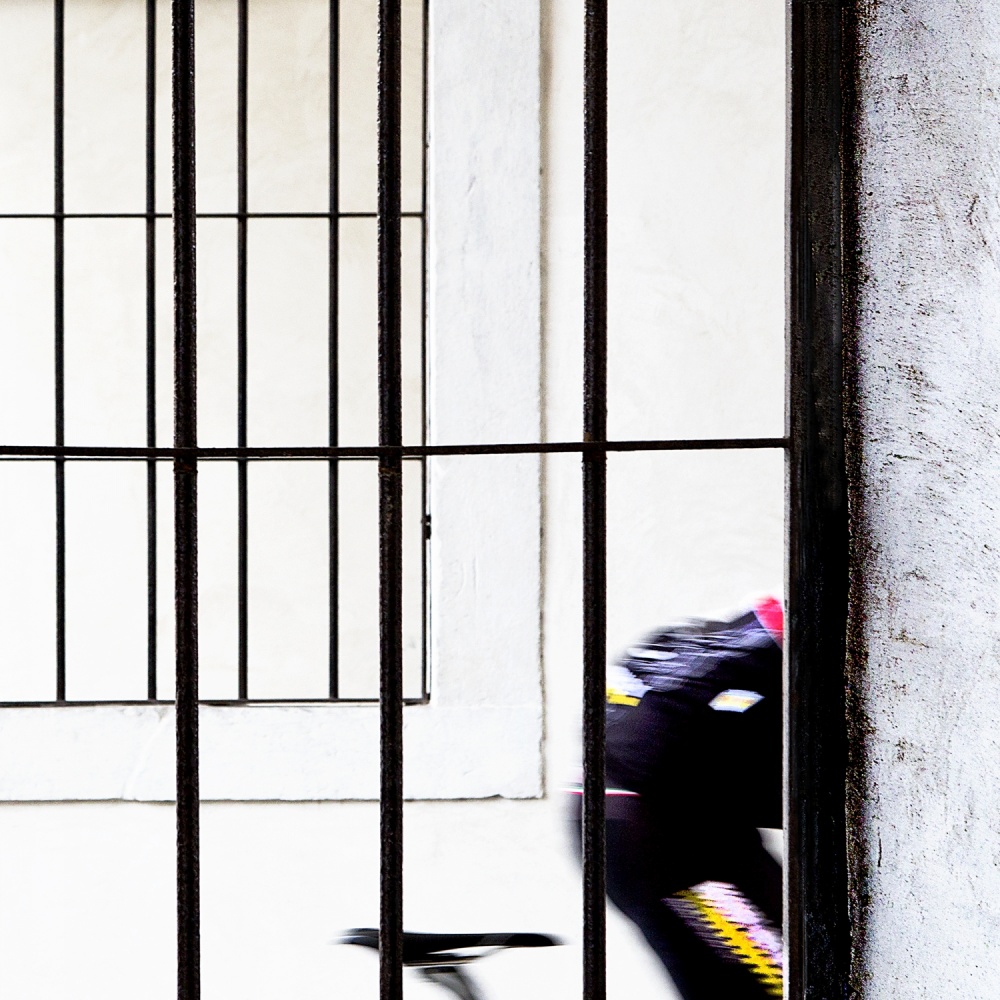 cyclist in black, yellow, white and red von Franco Maffei