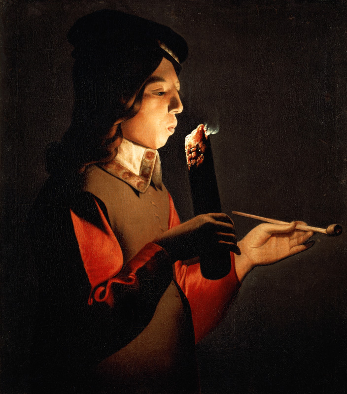 Ein Junge pustet in ein Feuer von Georges de La Tour