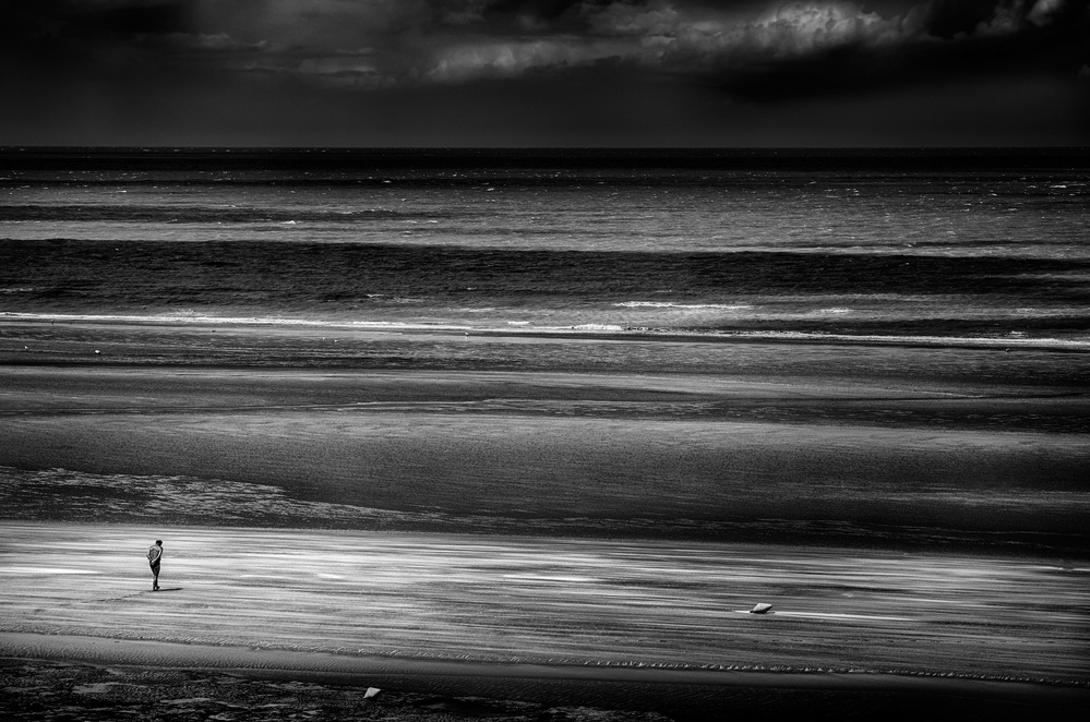 A lonely man on the beach. North France. von Giovanni Cavalli