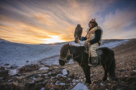 Sunset and an eagle hunter