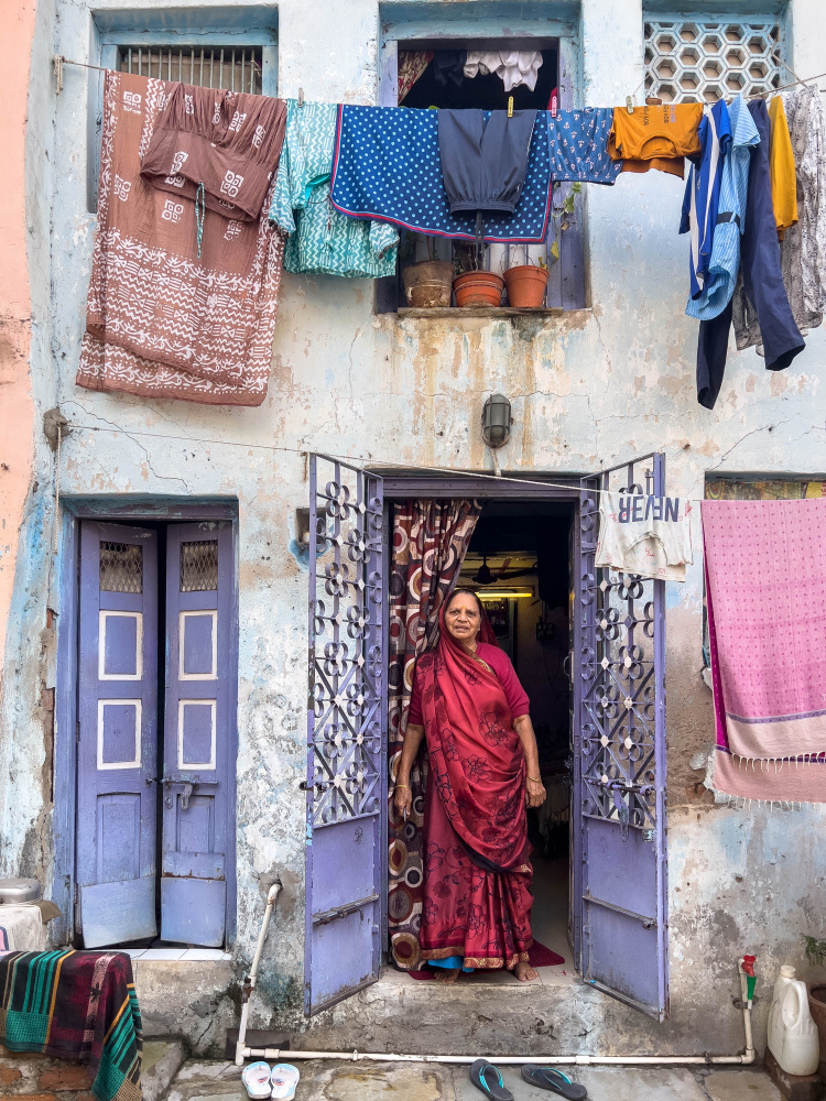 indian woman in red von Ilana Lam