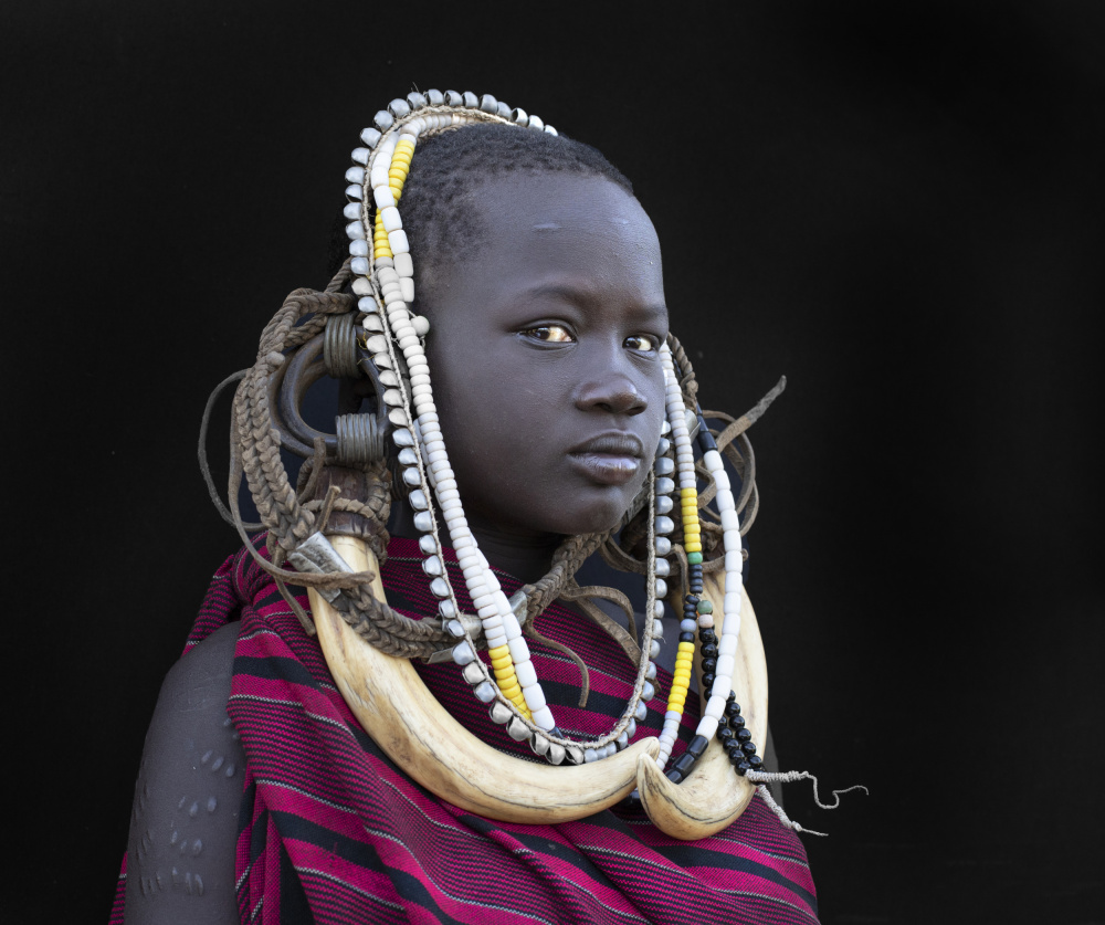 A young Mursi Girl von Iris Wiener