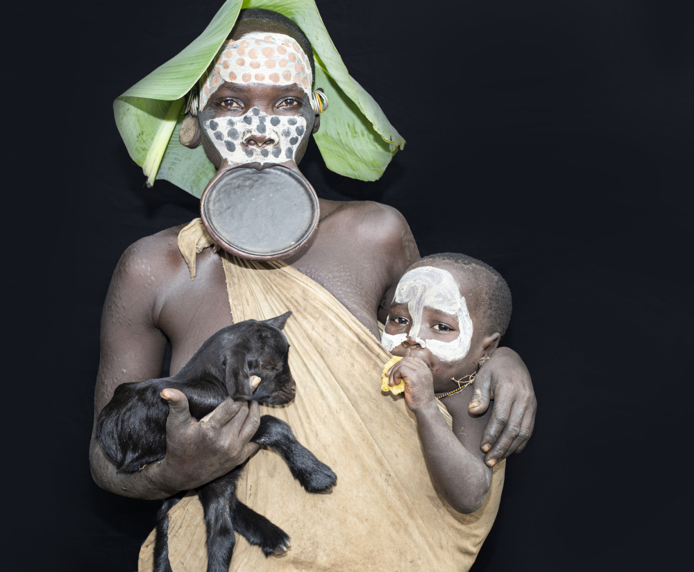 Young mother with her child and goat von Iris Wiener