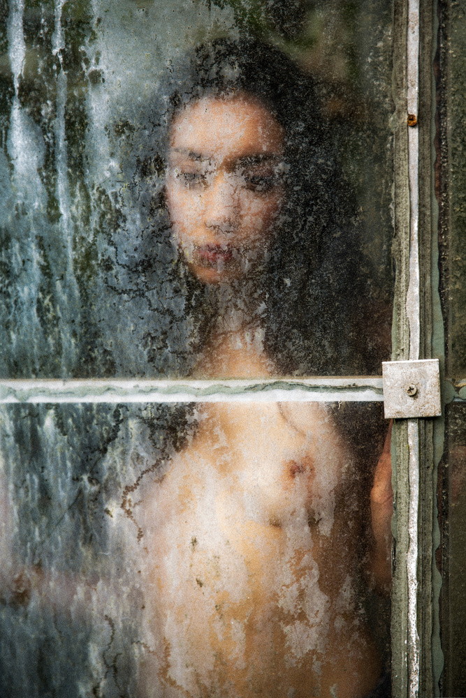 behind dirty window pane von Jan Slotboom