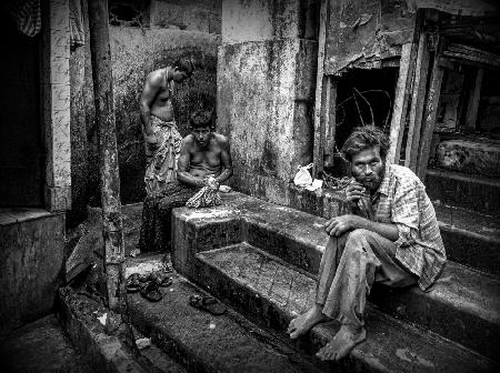 Three men in the streets of Kolkata (India)