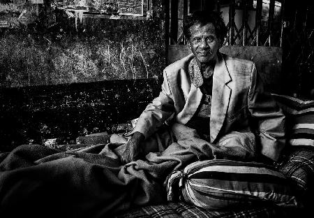 Lying in bed in a street of Bangladesh.