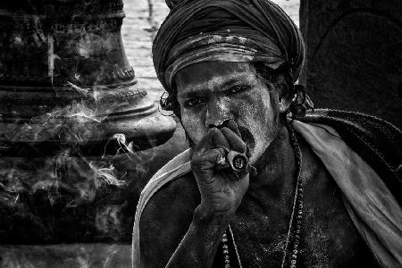 Smoking a chilum in Maha Shivaratri Festival in Pashupatinath Temple - Kathmandu-Nepal