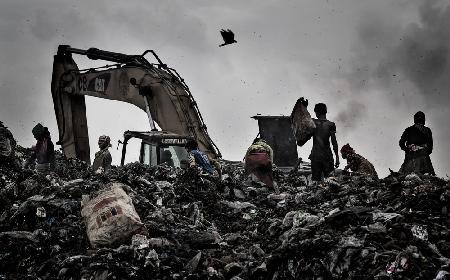 Searching for goods in a dumping site in Dakha - Bangladesh