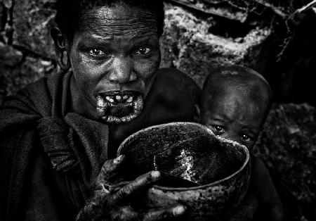 Surma woman drinking coffee.