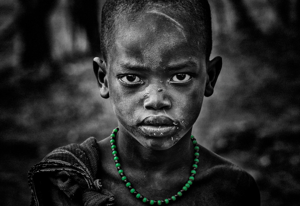 Surmi boy with a green necklace von Joxe Inazio Kuesta Garmendia