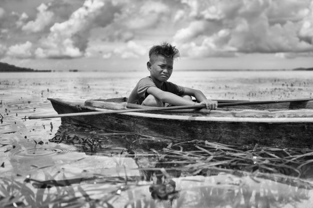 Boy in a Canoe von Kieron Long