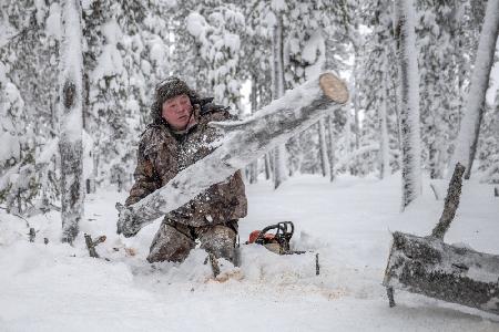 Kostya prepares firewood