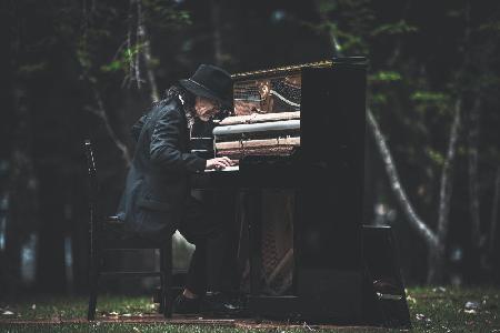 Playing piano in the forest