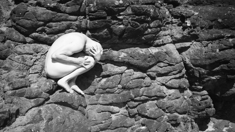 Rocks on the beach with Christian von Mel Brackstone