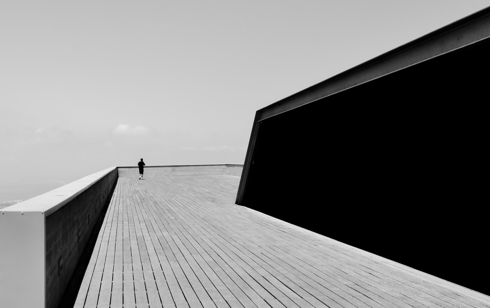 Man on wooden terrace BW von RABIA BASHA ARTIST