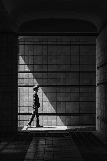 A man walking through the corridor