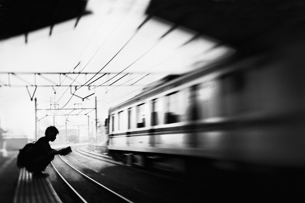 at the station series: 3/5. student &amp; train von Sebastian Kisworo