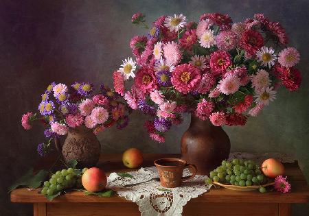 With bouquets of asters and grapes