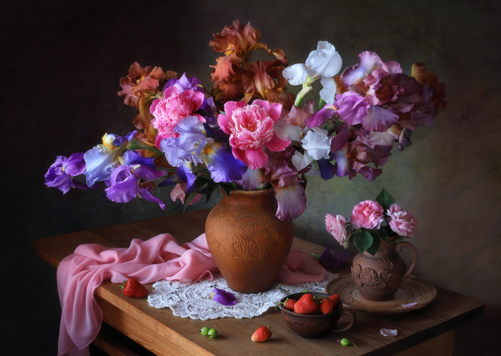 Still life with a bouquet of irises and berries von Tatyana Skorokhod