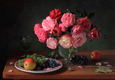 Still life with a bouquet of roses and fruits