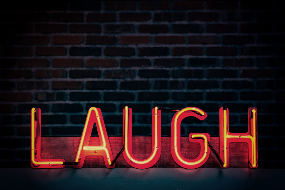 Laugh in Neon von Tim Mossholder